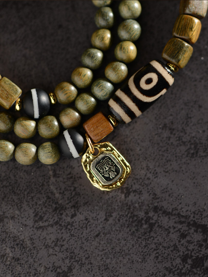 Bracelet de perles Dzi à deux yeux en agate de bois de santal vert