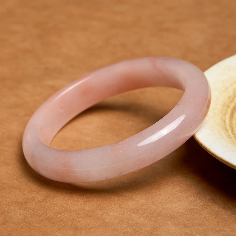Bracelet jonc en jade et soie rose doré avec pierres de Bouddha