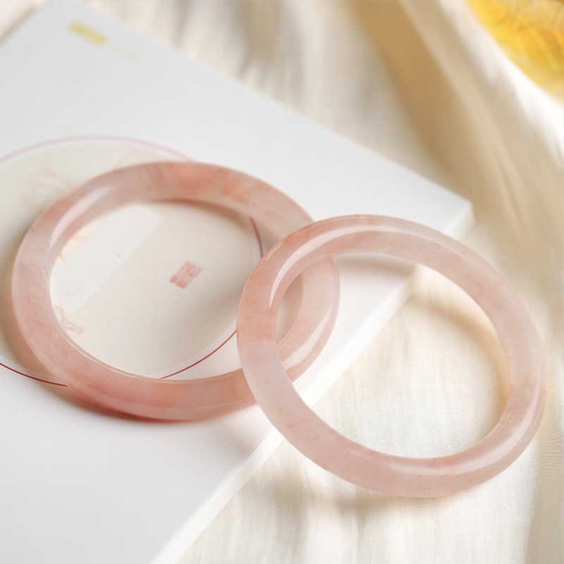 Bracelet jonc en jade et soie rose doré avec pierres de Bouddha