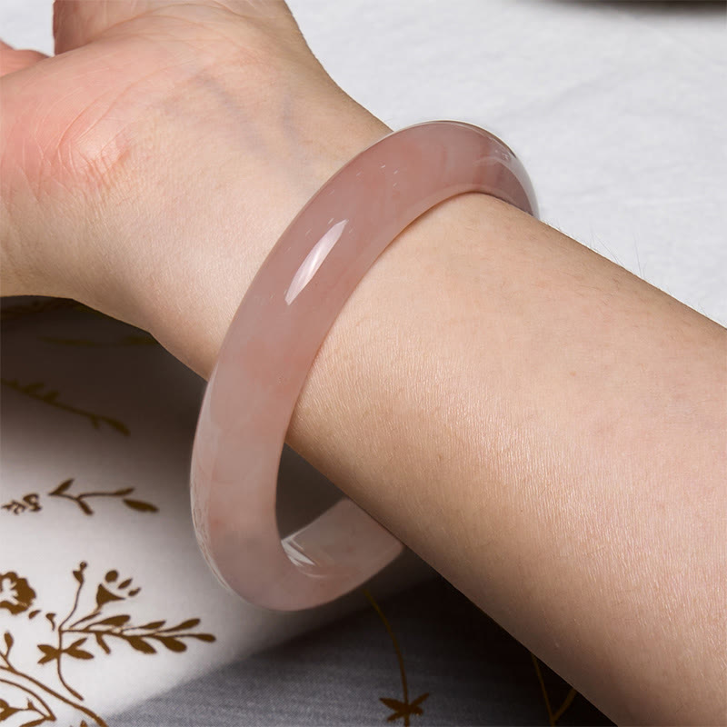 Bracelet jonc en jade et soie rose doré avec pierres de Bouddha