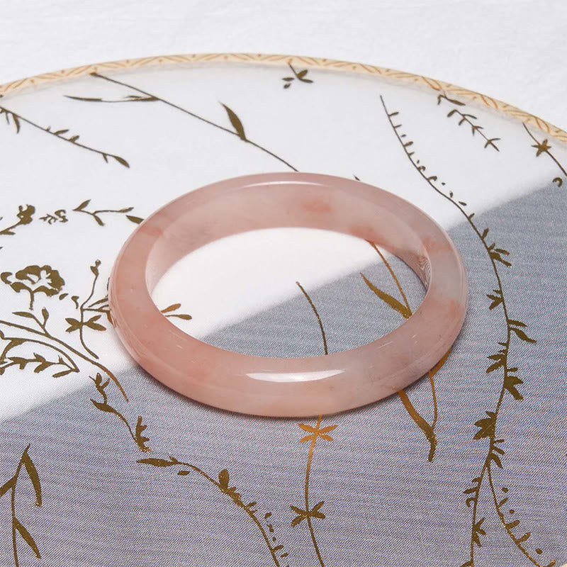 Bracelet jonc en jade et soie rose doré avec pierres de Bouddha