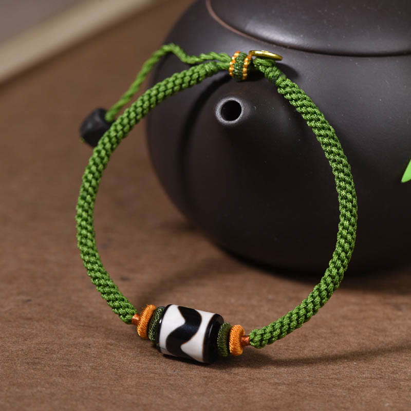 Bracelet de protection en corde verte tressée et perles dzi tibétaines faites à la main avec pierres de Bouddha