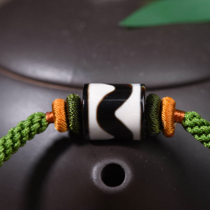 Bracelet de protection en corde verte tressée et perles dzi tibétaines faites à la main avec pierres de Bouddha