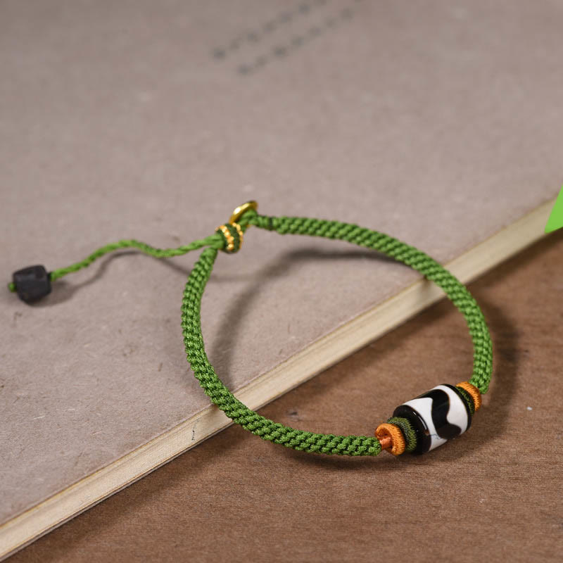 Bracelet de protection en corde verte tressée et perles dzi tibétaines faites à la main avec pierres de Bouddha