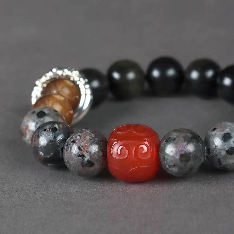 Bracelet de protection en obsidienne et agate rouge avec pierres de Bouddha et reflets dorés