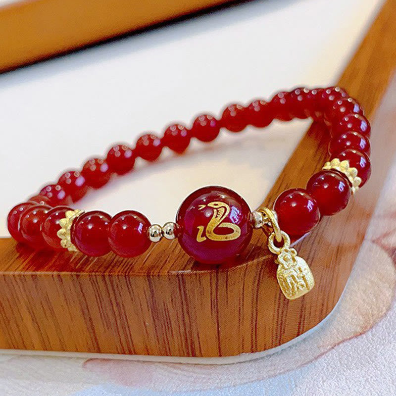 Bracelet Bouddha Stones en agate rouge et cuivre plaqué or, Année du Serpent