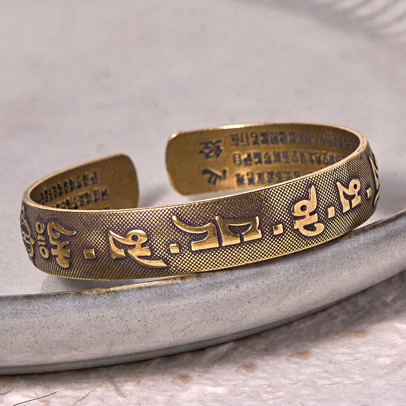 Bracelet porte-bonheur en cuivre et laiton avec six mots authentiques « Om Mani Padme Hum » et Sutra du cœur