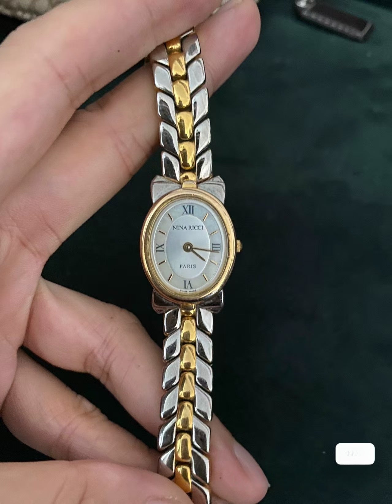 Montre vintage Nina Ricci Swiss Bow bicolore