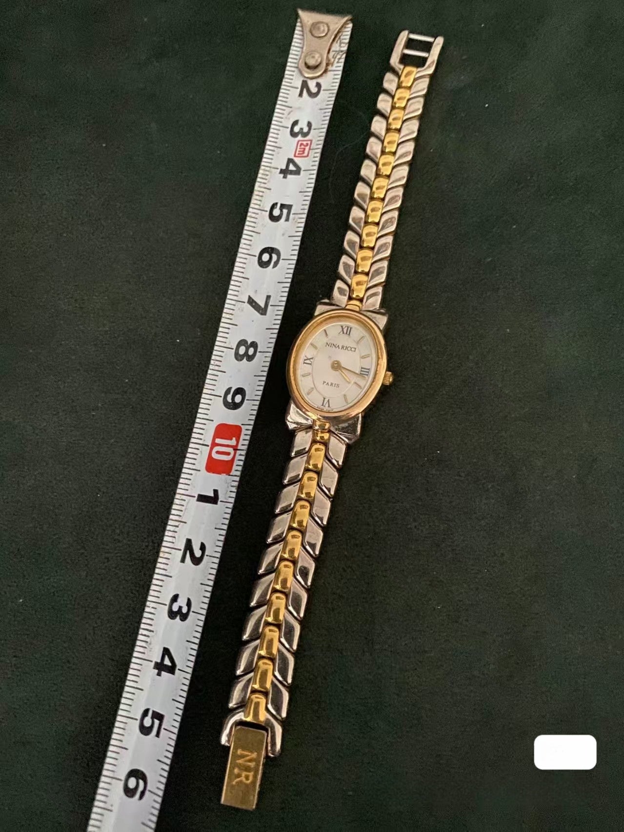 Montre vintage Nina Ricci Swiss Bow bicolore