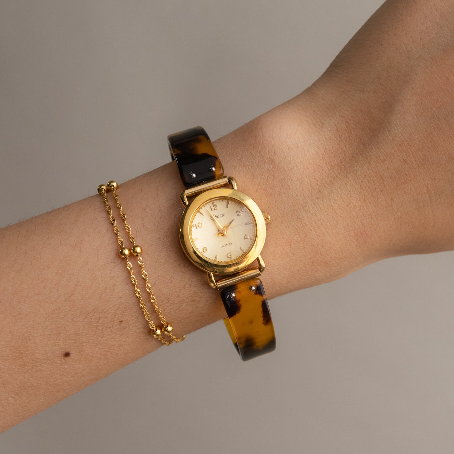 Montre ronde vintage Epoca en or écaille de tortue