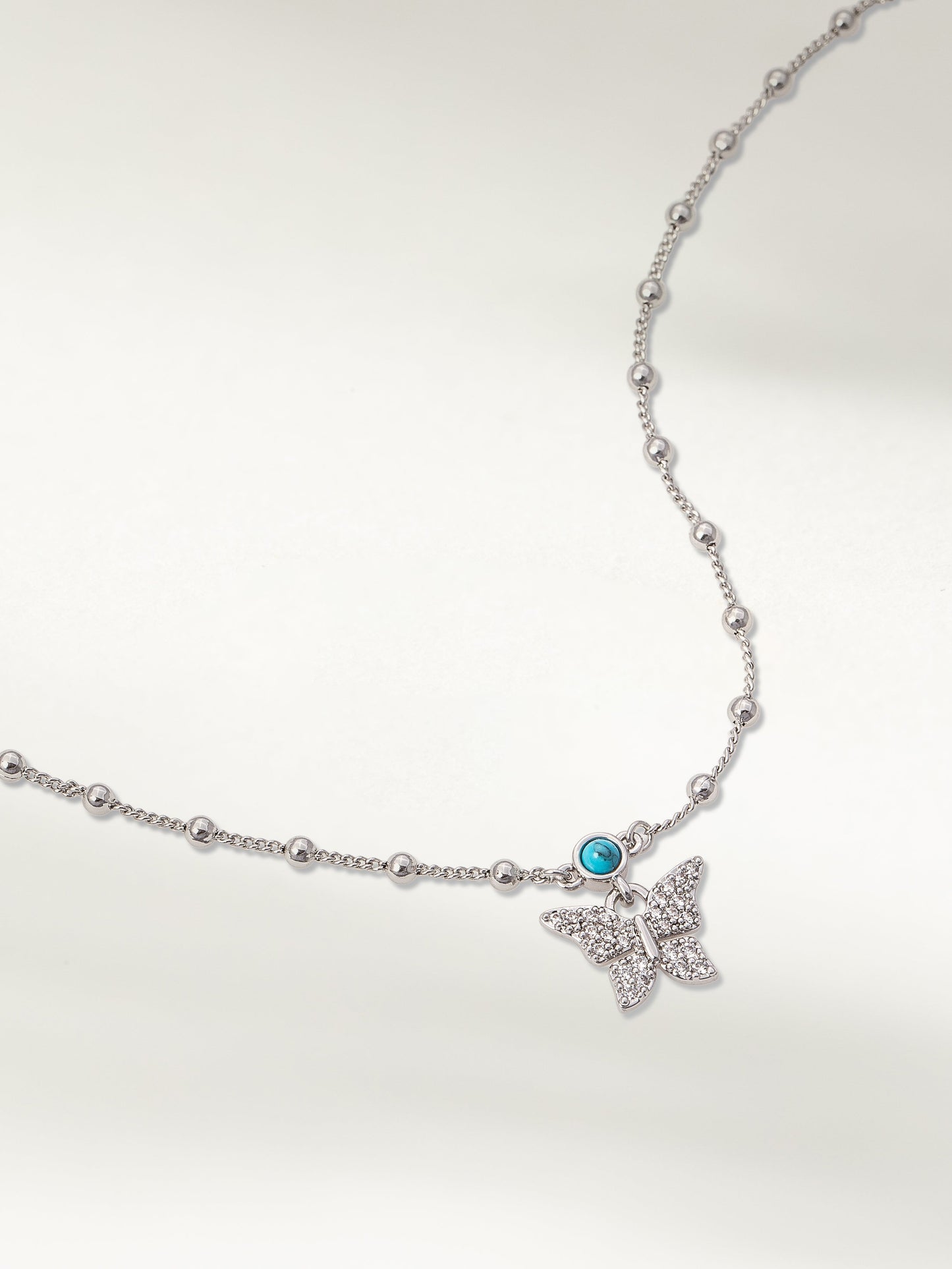 Collier pendentif jardin de papillons