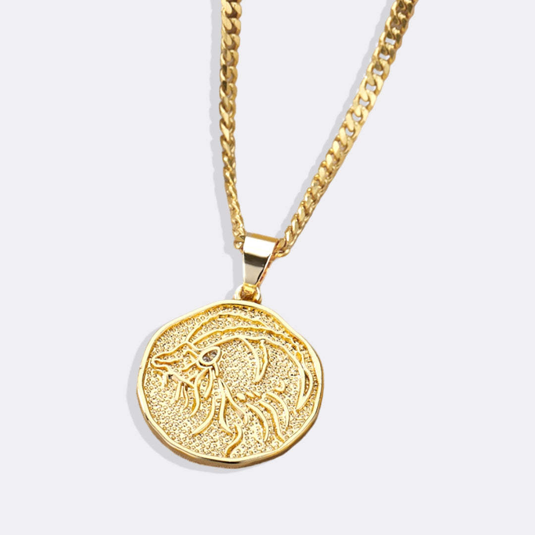 Collier avec pendentif en forme de pièce de monnaie représentant un signe astrologique