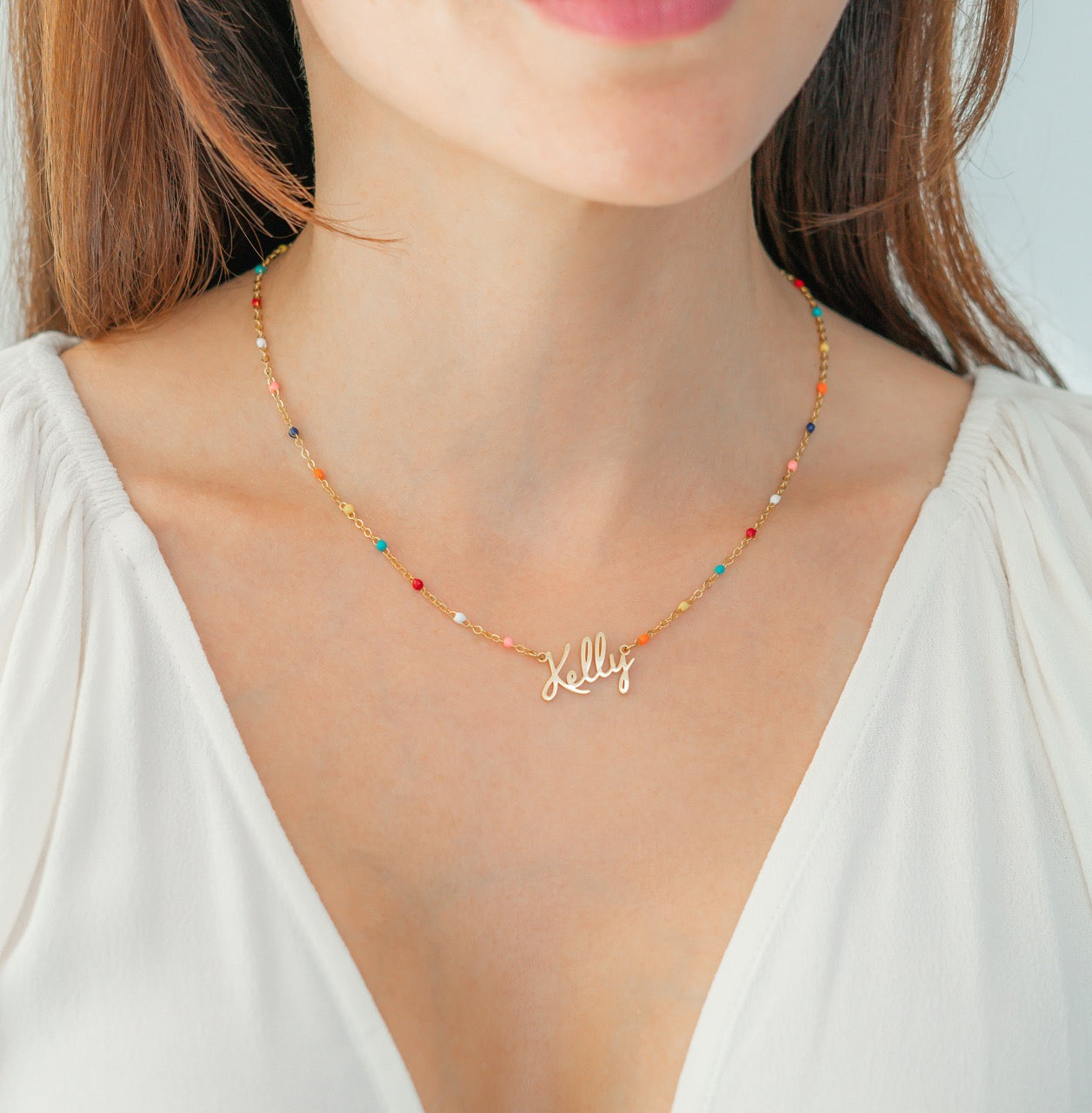 Collier de perles colorées avec nom de fée