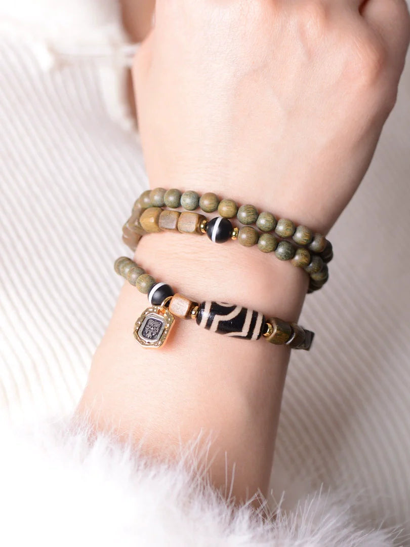 Bracelet de perles Dzi à deux yeux en agate de bois de santal vert