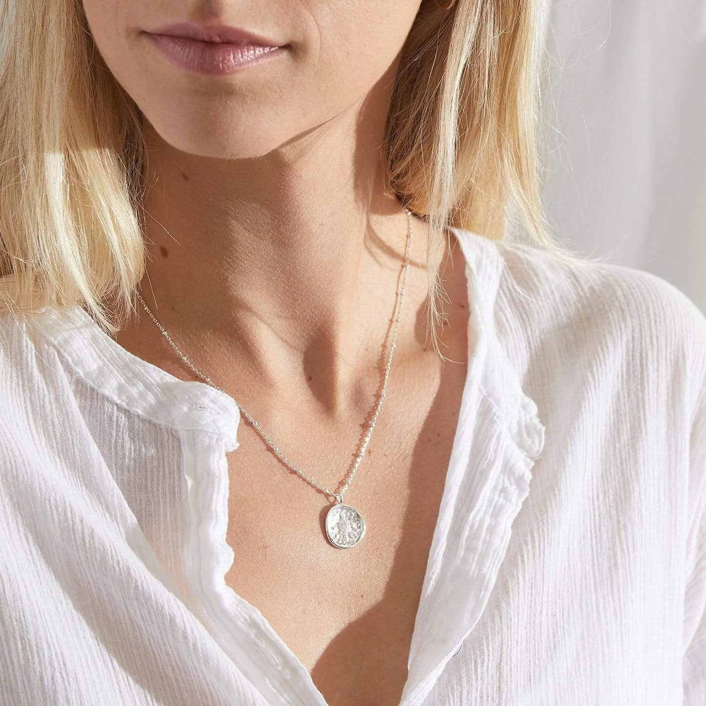 Collier pièce boussole