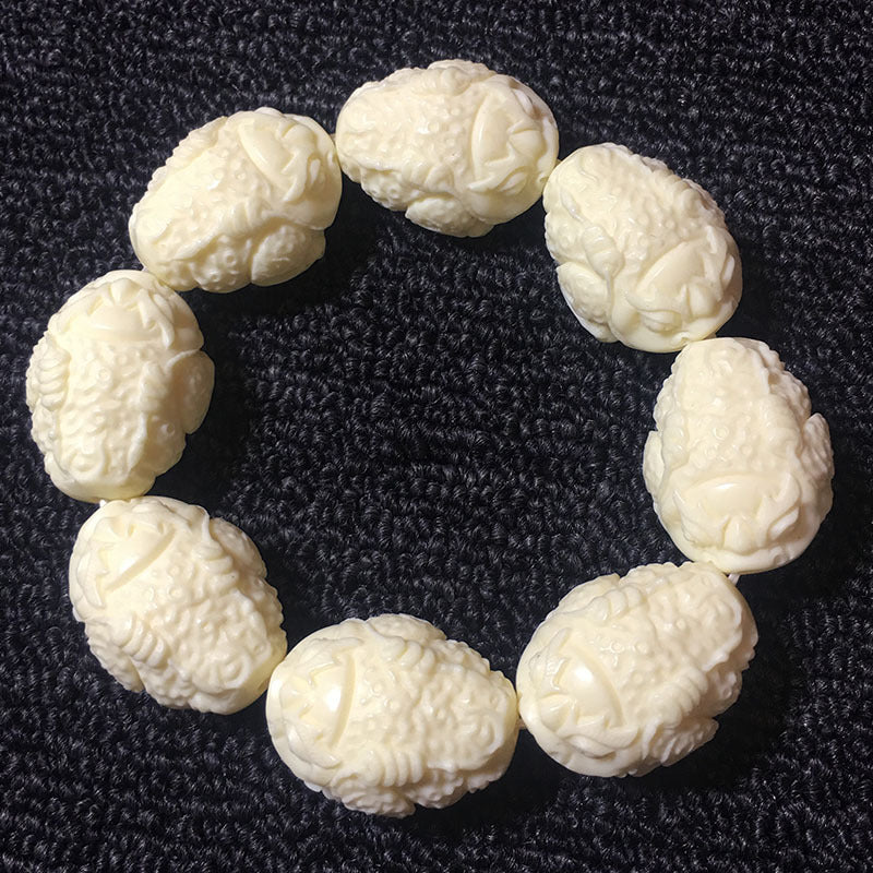 Bracelets finement sculptés en noix d'ivoire (divers thèmes)