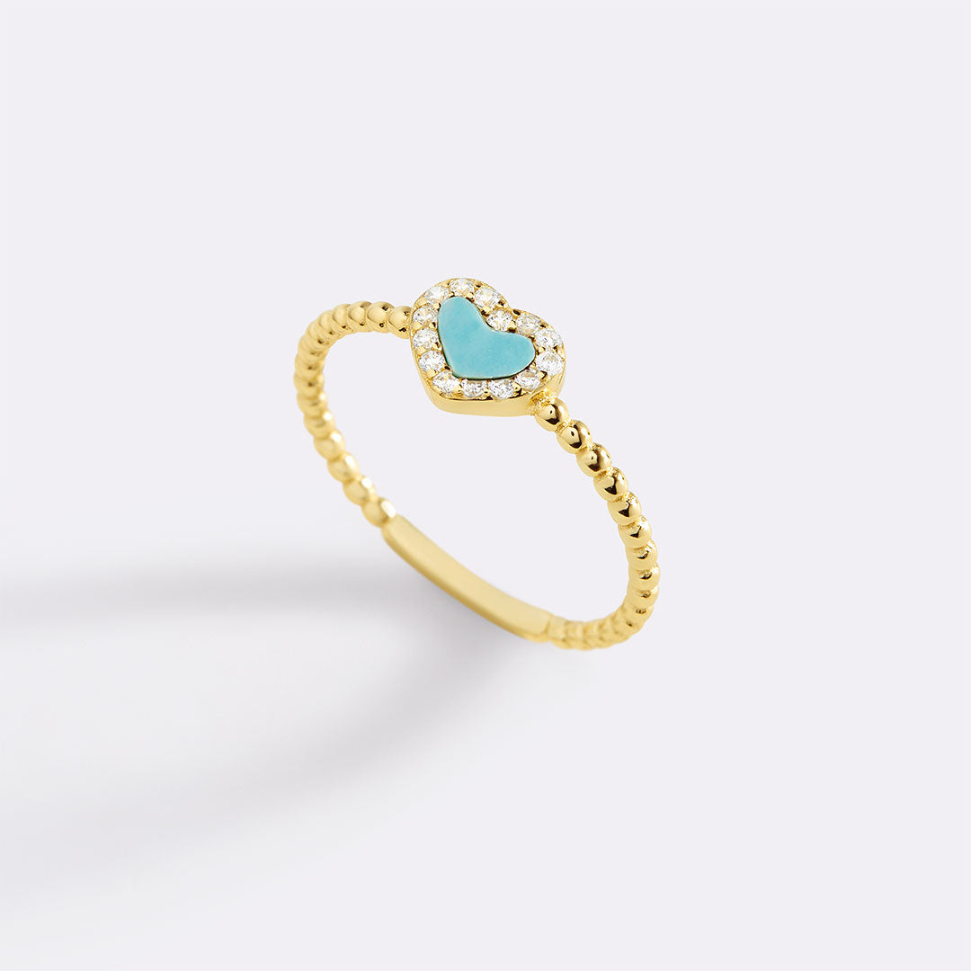 Bague en forme de cœur avec petite pierre précieuse