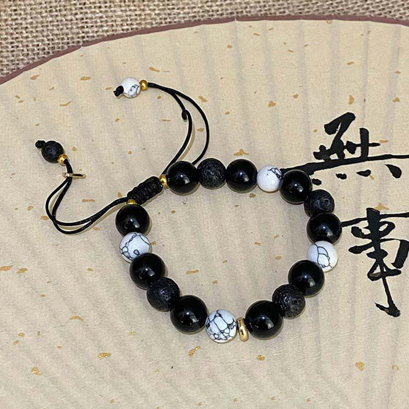 Bracelet de force Yin Yang en pierre de lave d'obsidienne noire de Bouddha