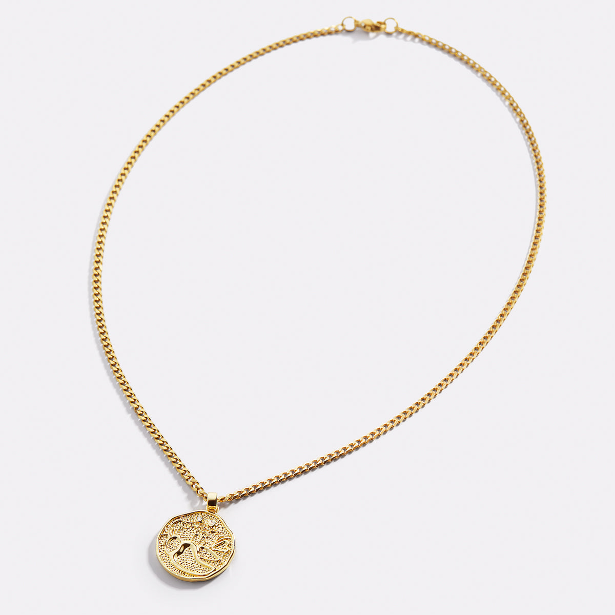 Collier avec pendentif en forme de pièce de monnaie représentant un signe astrologique