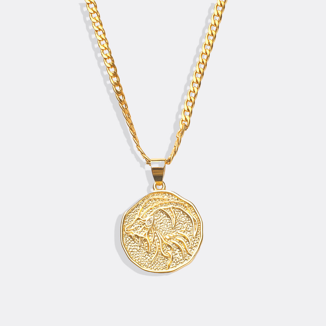Collier avec pendentif en forme de pièce de monnaie représentant un signe astrologique
