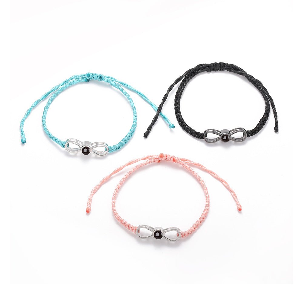 Benutzerdefiniertes geflochtenes Infinity-Zirkonarmband mit versteckter Fotoprojektion
