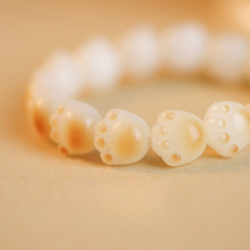 Joli bracelet Bodhi en patte de chat brûlée au charbon de bois