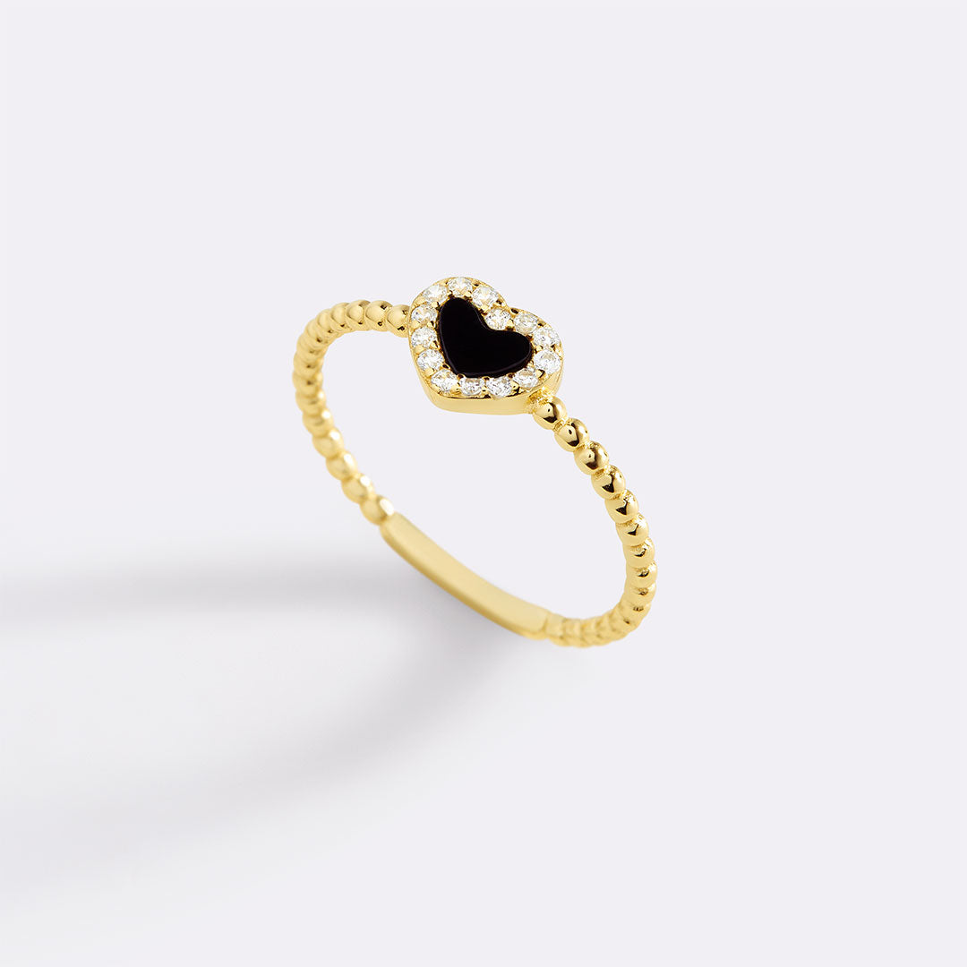 Bague en forme de cœur avec petite pierre précieuse