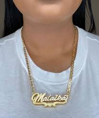 Embracing Individuality: The Emotional Journey of a Gold Name Plate Necklace