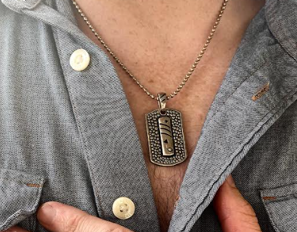 Reinventing Masculinity: The Story Behind Male Necklaces