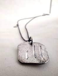 The Emotional Connection Behind Men's Necklace Pendants