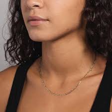 The Heart of Elegance: A Journey with the 2mm Gold Figaro Necklace