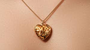 The Heartfelt Charm of Gold Locket Necklaces