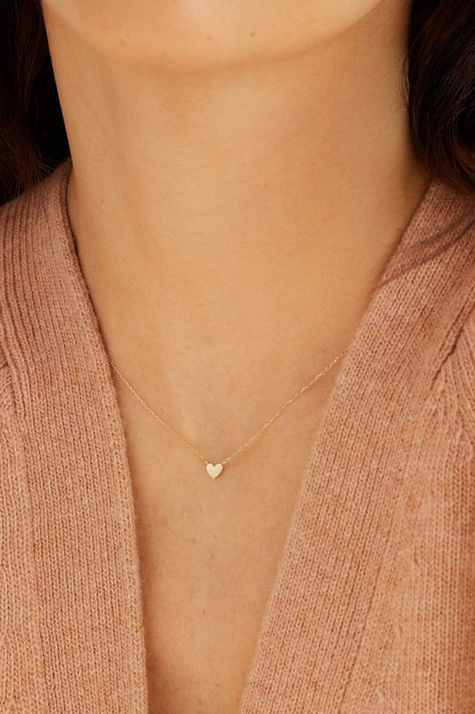 The Timeless Elegance of the Gold Heart Necklace in Photography Trends