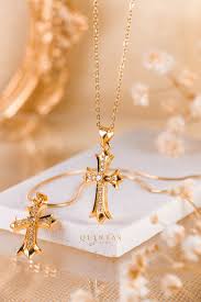 Title: Embraced by Elegance: The Gold Cross with Diamond Necklace