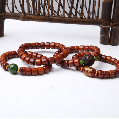 Bracelet de force en agate rouge et corne de mouton en os de yak tibétain à trois yeux et perles dzi 