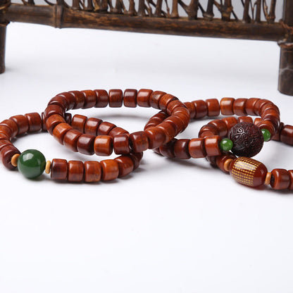 Bracelet de force en agate rouge et corne de mouton en os de yak tibétain à trois yeux et perles dzi 