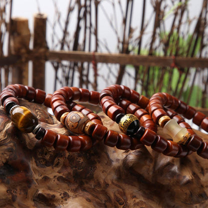 Bracelet de force en agate rouge et corne de mouton en os de yak tibétain à trois yeux et perles dzi 