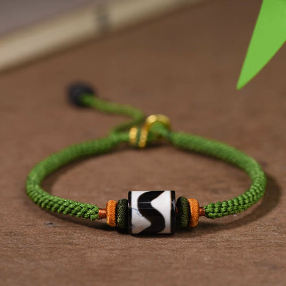Bracelet de protection en corde verte tressée et perles dzi tibétaines faites à la main avec pierres de Bouddha 