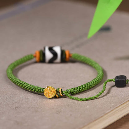 Bracelet de protection en corde verte tressée et perles dzi tibétaines faites à la main avec pierres de Bouddha 