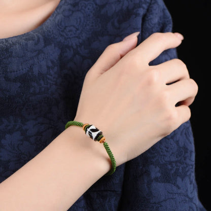 Bracelet de protection en corde verte tressée et perles dzi tibétaines faites à la main avec pierres de Bouddha 