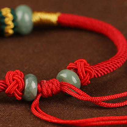 Bracelet en corde rouge avec perles de boulier en jade et pierres de Bouddha