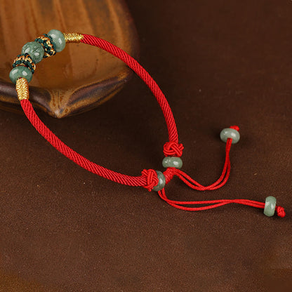 Bracelet en corde rouge avec perles de boulier en jade et pierres de Bouddha