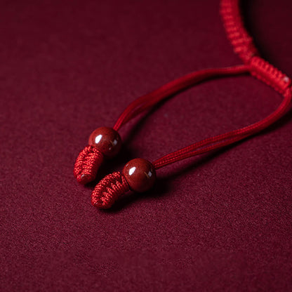 Bracelet tressé en fil rouge fait main avec poignée en cinabre Ruyi et caractère Fu PiXiu