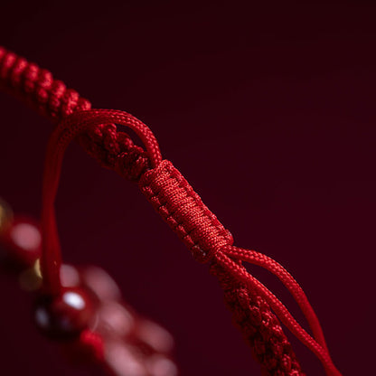 Bracelet tressé en fil rouge fait main avec poignée en cinabre Ruyi et caractère Fu PiXiu