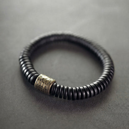 Bracelet calme en bois d'ébène et cuivre et laiton avec pierres de Bouddha 