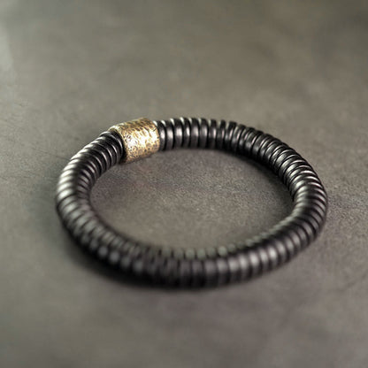 Bracelet calme en bois d'ébène et cuivre et laiton avec pierres de Bouddha 