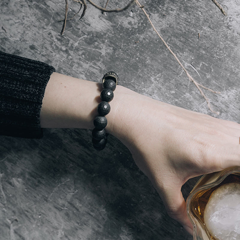 Bracelet de protection en cuivre et laiton avec pierres de Bouddha givrées mates et onyx noir 