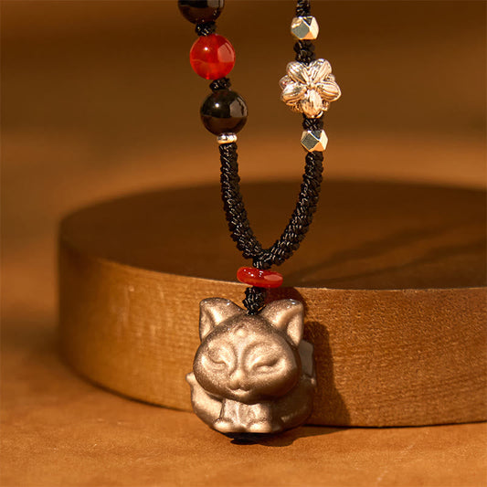 Collier pendentif de protection en obsidienne naturelle argentée et brillante représentant un renard à neuf queues 