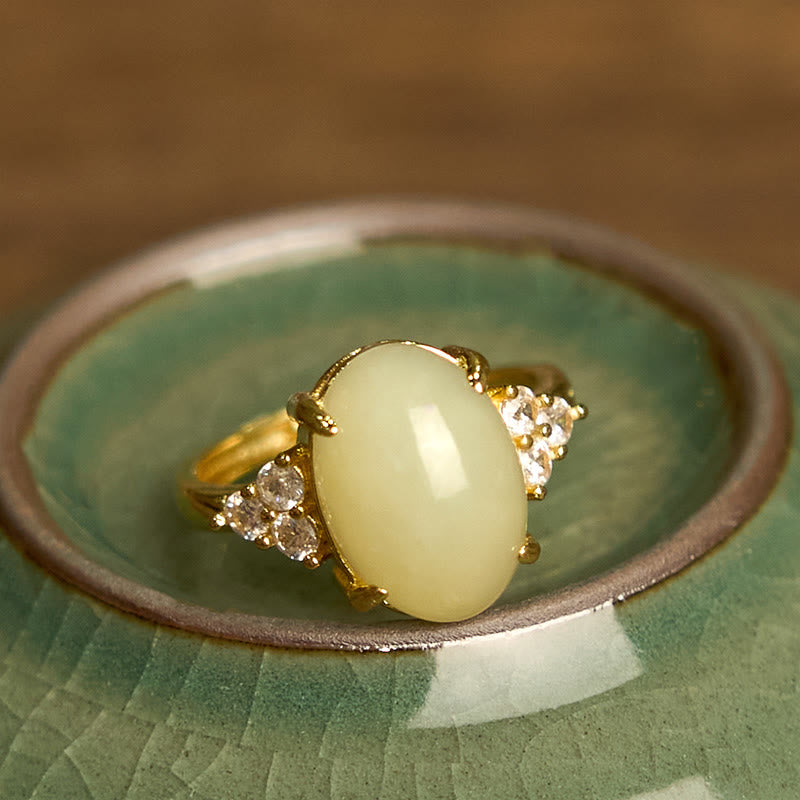 Bague en alliage d'œuf de jade Hetian avec pierres de Bouddha 