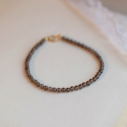 Bracelet de réussite ultra-fin en quartz fumé et obsidienne noire Buddha Stones 